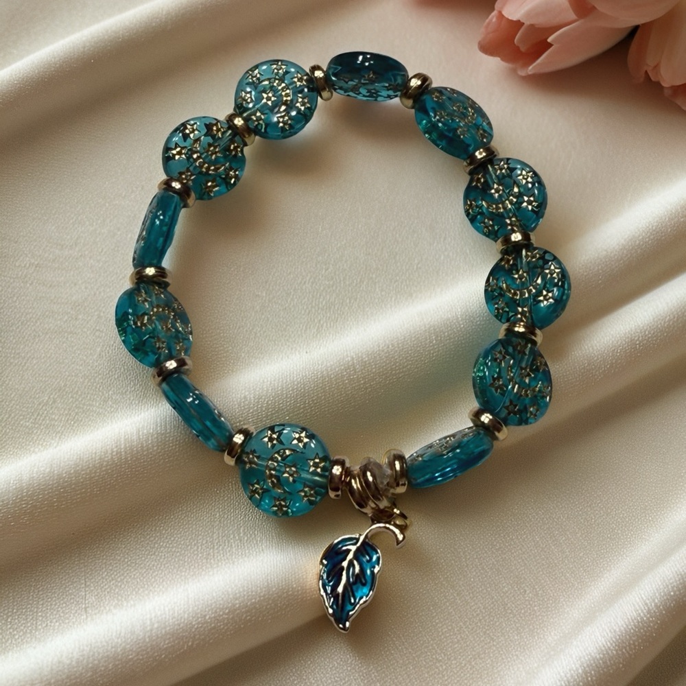Hand Crafted Teal Acrylic Bead Bracelet with Gold Accents and Leaf Charm - Picture 4 of 5
